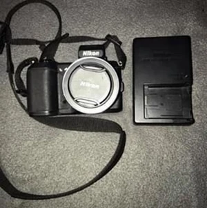 Nikon 1 v2 black and grey DSLR CAMERA - Hardly used, great condition. Comes with memory card. 