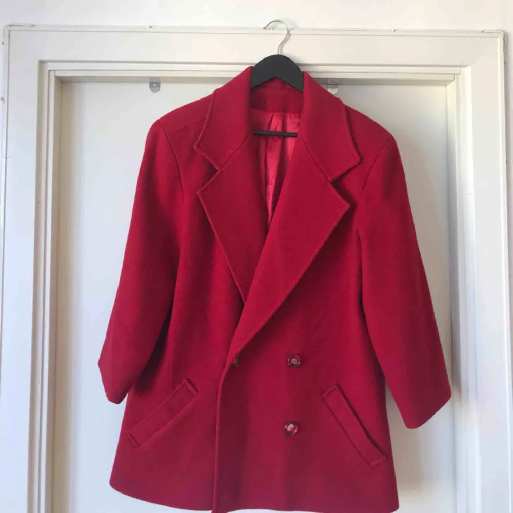 perfect condition! beautiful red and buttons so unique, marble red. bought at a vintage store and have only worn once! plus SICK SHOULDER PADS!. Jackor.