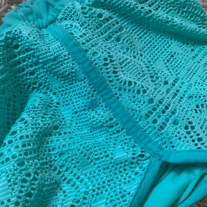 Turkosa badshorts - Använda en gång. Snörbara i midjan