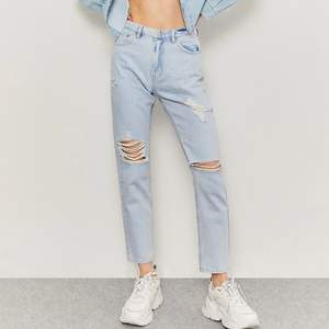 These Tally Weijl Ripped mom jeans are an European size 32. They are high wasted, and the quality is nice!