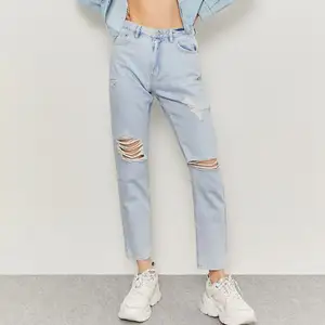 These Tally Weijl Ripped mom jeans are an European size 32. They are high wasted, and the quality is nice!