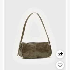 Grön väska - Grön väska med mönster på från Nelly.com, 1 år gammal så bra skick. Nypris 299 kr.