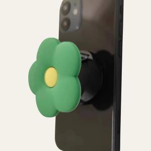 Säljer en ny fin blomma-popsocket. Den är oanvänd och ligger kvar i förpackning.