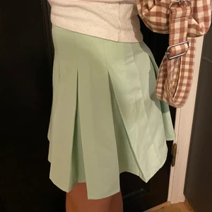 Ljus grön kjol - Ljus grön vecklas tennis kjol