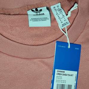 Adidas tröja i st L i rosa 
