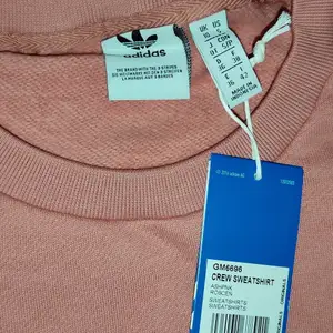 Adidas tröja i st L i rosa 