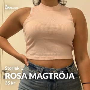Rosa magtröja - Babyrosa magtröja i storlek L, passar dock även de som använder M. Är i bra skick och sällan använd. Hör av er för fler bilder!