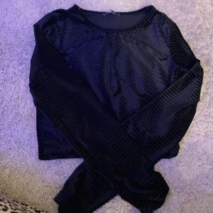 En silkes tröja från new yorker tror jag  - De en tröja i samhet typ 