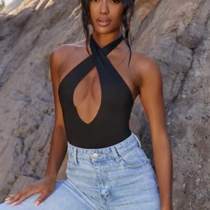 Body från Ohpolly - Oanvänd body från Ohpolly, strl 34. 200 kr