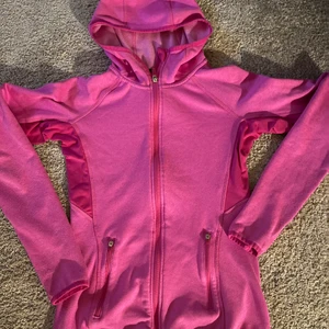 H&M träningsfleece - Träningsfleece från H&M i rosa neon färg i storlek xs. Med luva och två fickor.