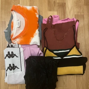 Klädpaket XS-M - 6 tröjor & 2 par byxor, bland annat ett par kappa byxor (har en synlig liten fläck på sig)