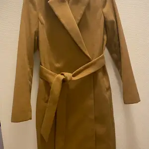 This is long  coat with brown color 