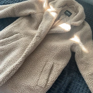 Kappa i nyttskick - Kappa från Nelly i strlk XS passar även S! Använd några få gånger är som i nytt skick!!