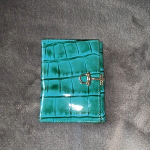 Plånbok - Oanvänd plånbok som är köpt i Italien.