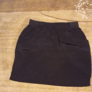 Black pretty short skirt. - It's been worn probably 2 time.