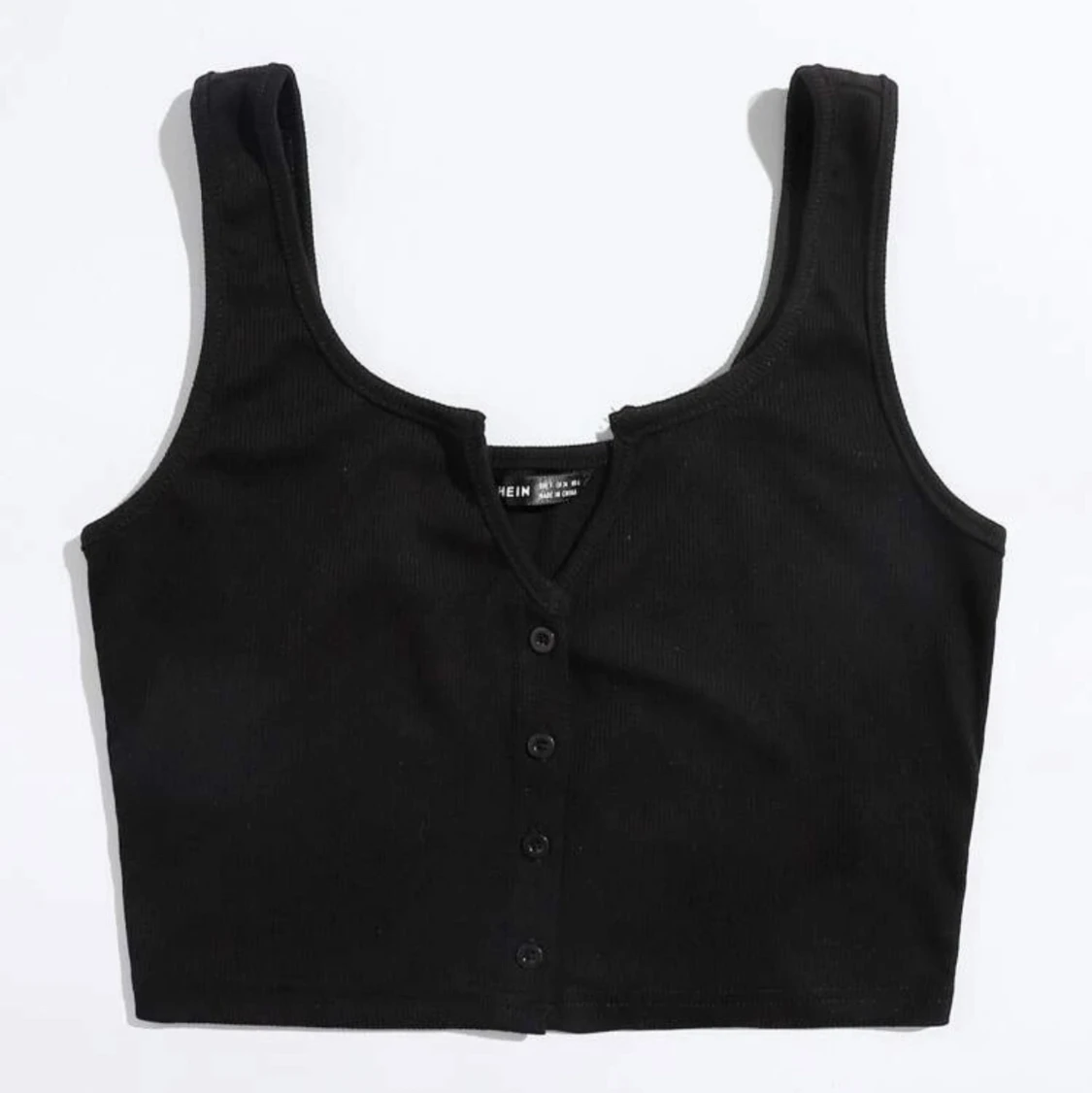 Svart linne med knappar