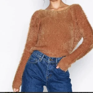 Deep back knitted sweater - Knitted sweater from NLY Trend Size:S  Great condition. Worn only once. Very flattering back.  Long-sleeved model in soft yarn Rounded neckline Deep v-neck at the back with knot detail