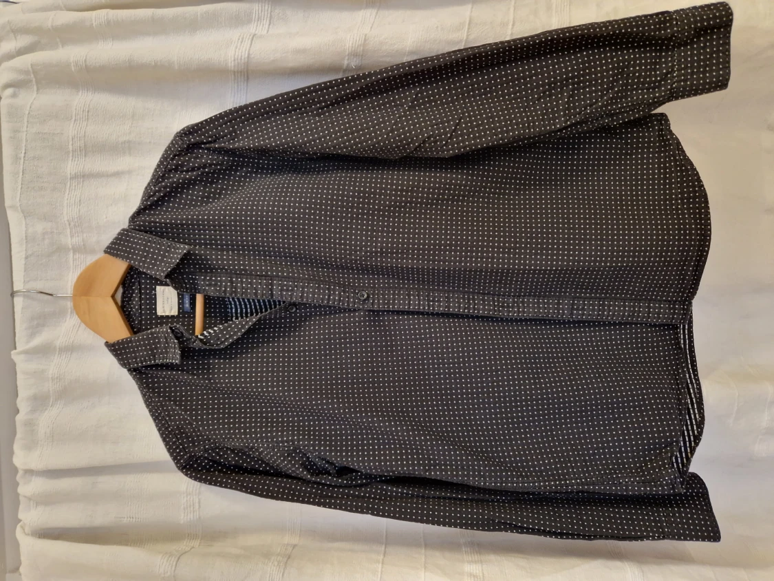 Black shirt with white dots