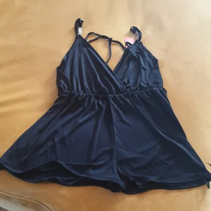Sweet black playsuit - Sweet and sexy black smooth and shimmery playsuit, for evening wear or casual/beach day. 98% polyester