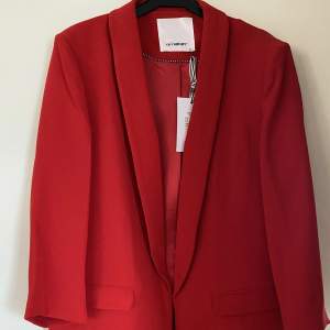 Completely new, never worn bright red blazer.
