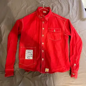 limited time edition, the red Carhartt x Vetements workwear shirt is no longer manufactured.  Worn a couple of times but it is in almost perfect condition.  