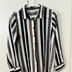 Striped shirt with chain detail - In great condition, Perfect for office wear, summer wear. Have a satin feel