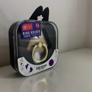 Mobilring  - Helt ny och oöppnad mobilring/Ringhållare i original förpackning