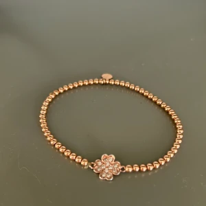 Syster P armband  - Fint skick. Inget att anmärka på. Rosé färgat. 