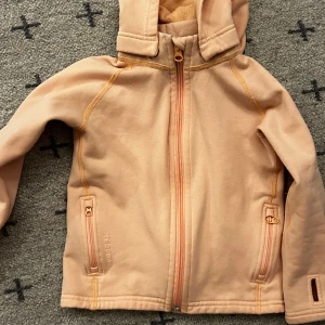 Houdini fleece - Varm fleece med avtagbar huva i storlek 100