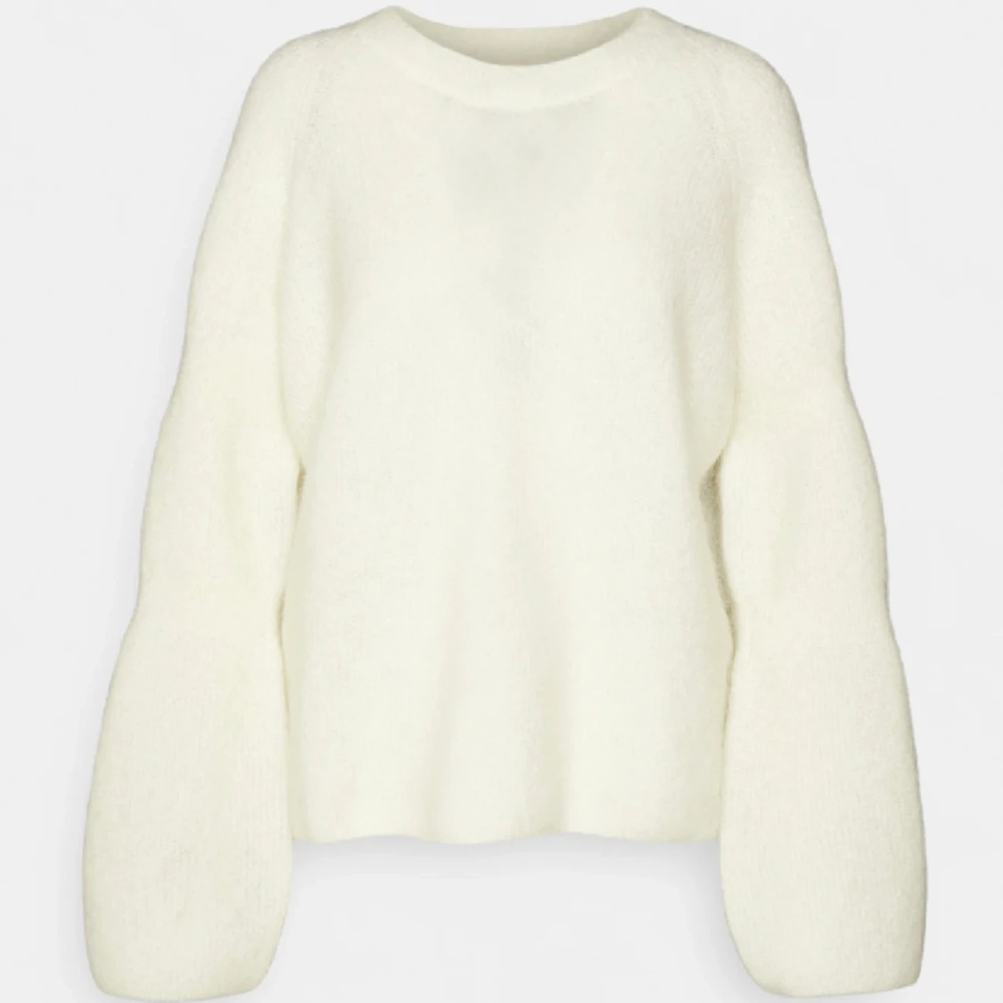 Vit stickad tröja arket