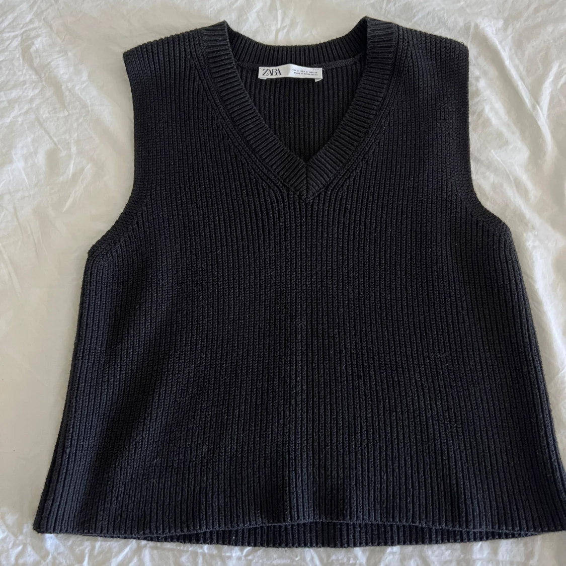 Svart stickad vest