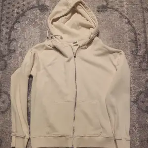 Naturvit zip hoodie urban classic. Oanvänd