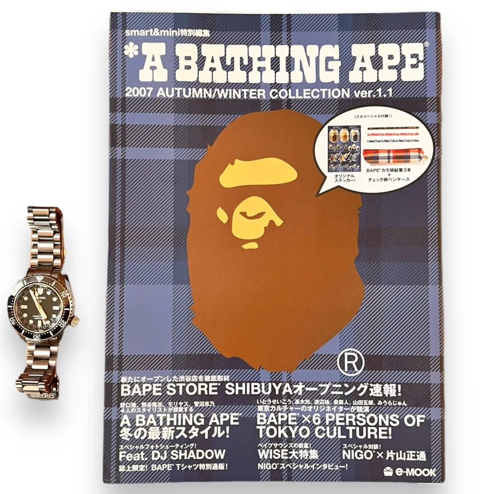 BAPE Magazine Book from 2007  72 pages of crazy lookbook collections showing products from the season, full sticker pack. Watchfor reference on how big the book is. Super cool accessory for anyone that loves Bape. These are a very interesting read!  . Accessoarer.