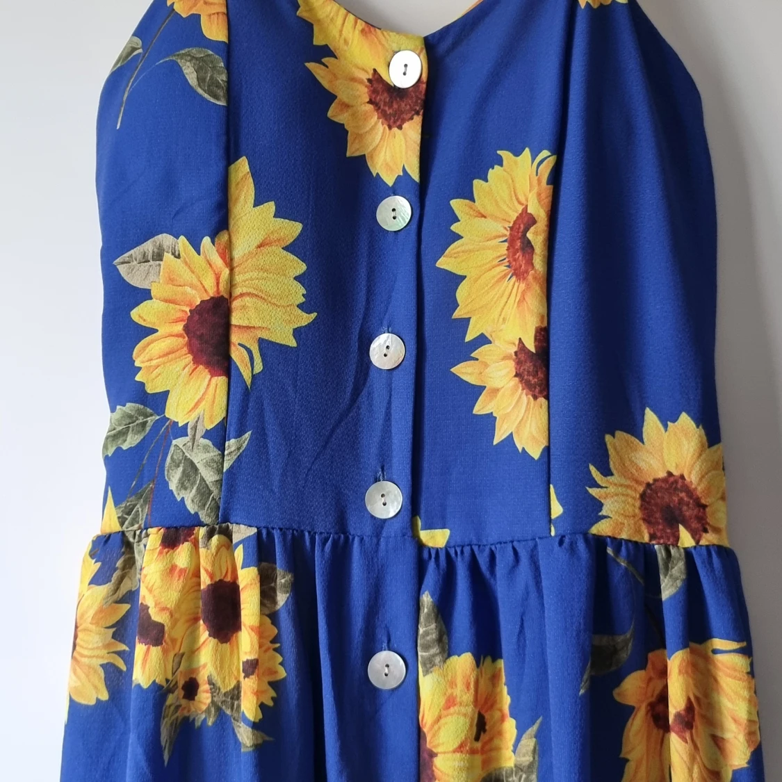 Blå långklänning med solrosor - 1