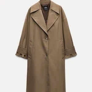 Trenchcoat - Så cool trenchcoat från Zara i en typ brun/biege/grön färg. 
