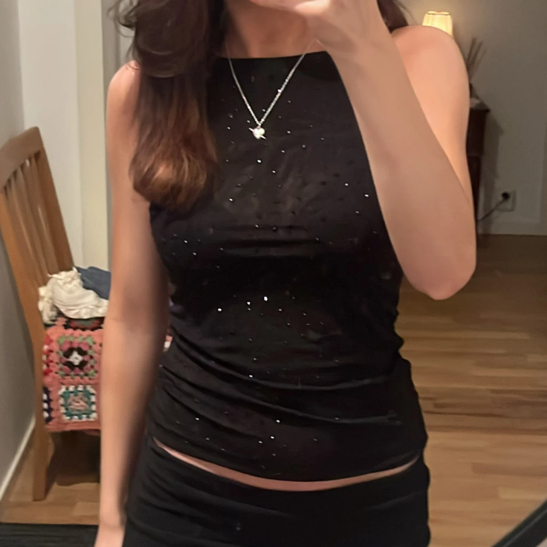 Svart glittrig linnetopp