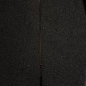 Wilson staff klubba höger 5 - Bilderna visar en golfklubba, specifikt en Wilson Staff järnklubba nummer 5. Det finns ingen bok synlig på bilderna, endast sportutrustning.