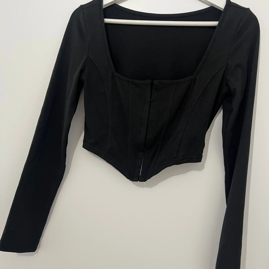 Svart långärmad korsettopp
