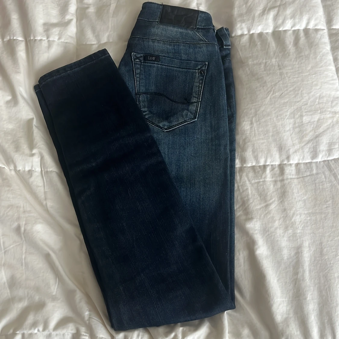 Mörkblå jeans från Lee X-Line W26