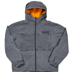 Capeesh giacca #9 - Snygg vändbar jacka från Capeesh med huva. Ena sidan är grå med en stor ficka framtill, medan den andra är orange med en mindre bröstficka. Jackan har dragkedja och elastiska muddar vid ärmsluten.