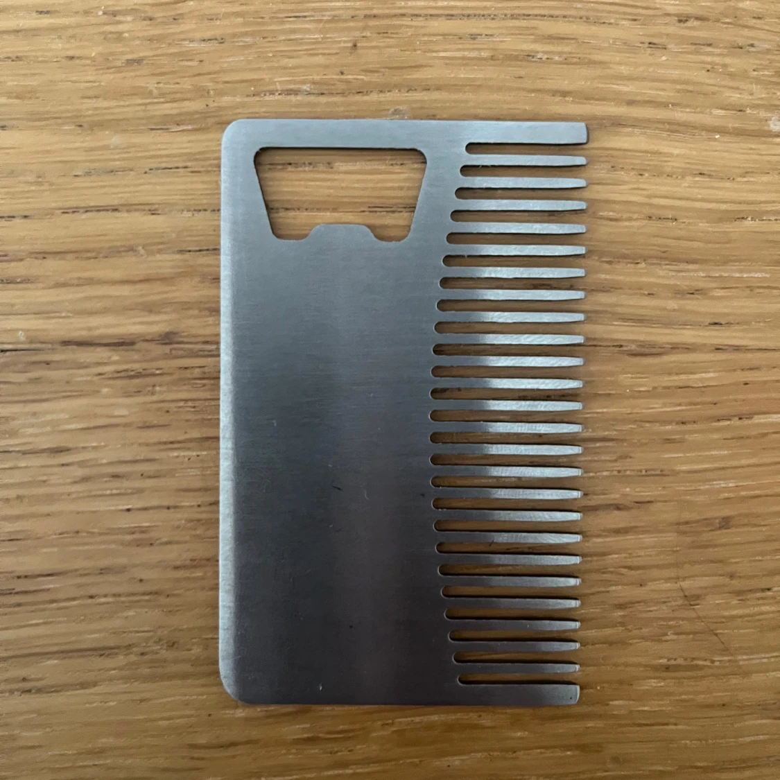 Hårkam plus kappsylöppnare