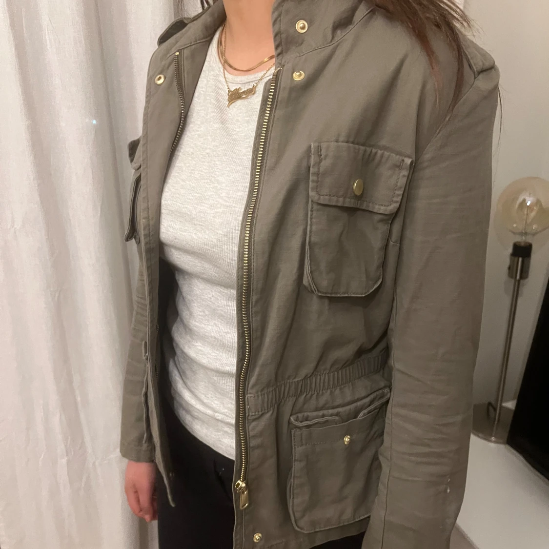 Grön parkajacka med dragkedja