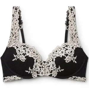 Intimissimi bh - Elegant svart behå med vacker vit spets och blommönster. Den har justerbara axelband och en bekväm passform. Perfekt för att känna sig extra fin. Helt oanvänd