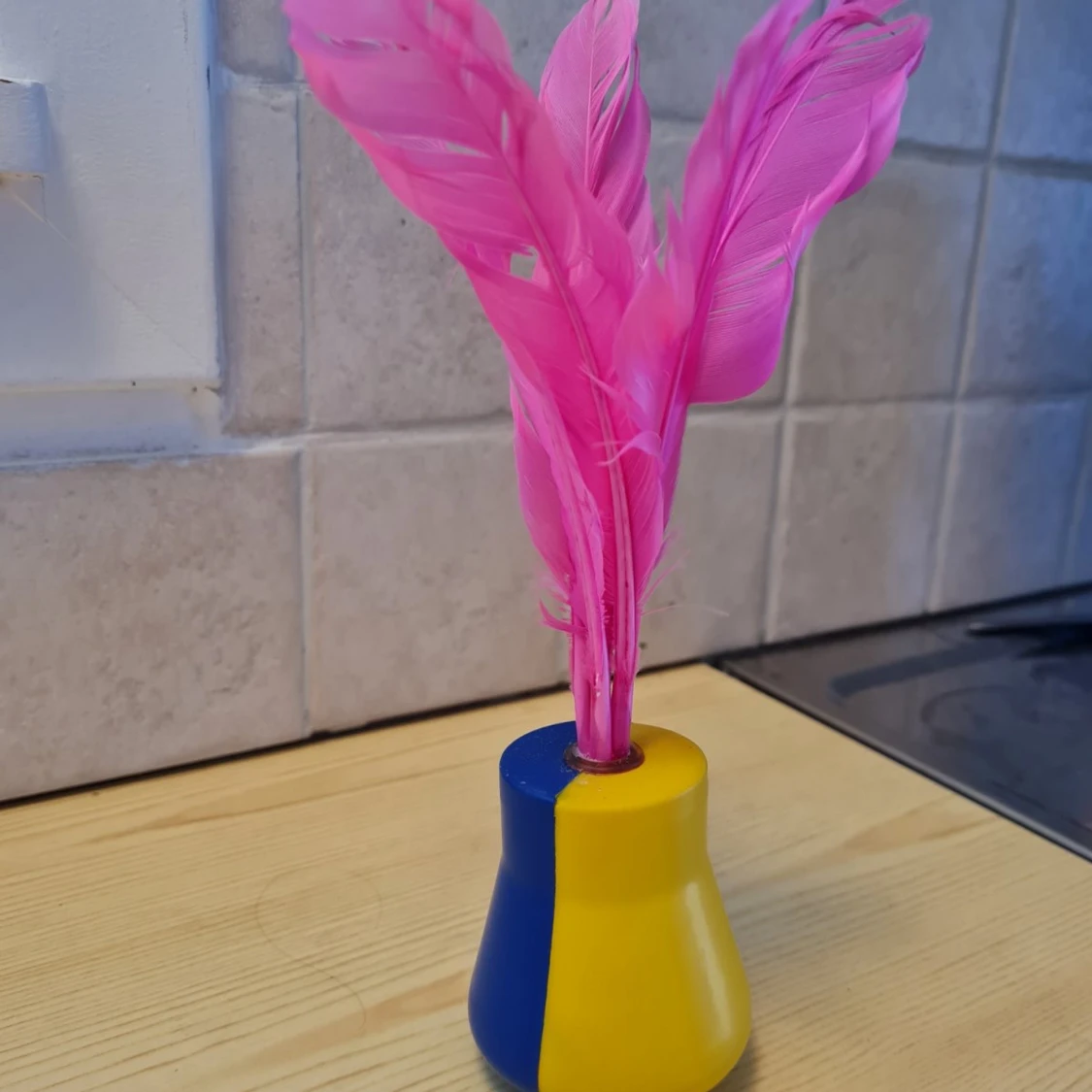 Badleksak med fjäder