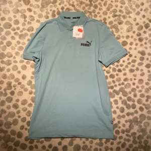 Grön akrig pique från puma - Helt ny puma pique aldrig använd och är i super bra skick nypriset var 349kr