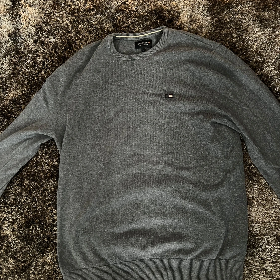 Blå stickad tröja från Lexington