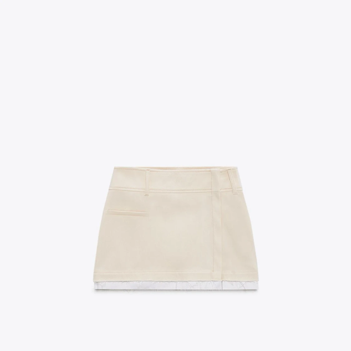 Vit kortkjol med rå kant