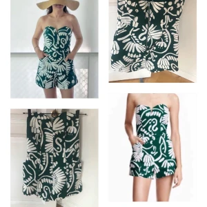 Grön och vit byxdress med blommigt mönster - Säljer en snygg grön byxdress med vitt blommigt mönster. Byxdressen är axelbandslös med hjärtformad urringning och dragkedja bak. Den har fickor och korta ben, perfekt för varma dagar.