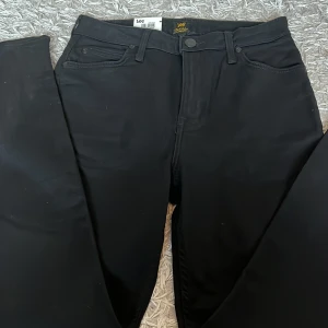 Lee - Ett par jättefina lee jeans i ny skick 