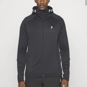 Peak Performance ziptröja svart - Svart peak zip storlek M